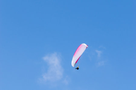 paraglider against the blue skyの写真素材
