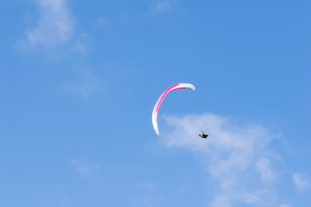 paraglider against the blue sky