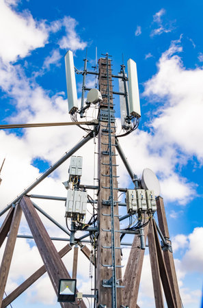 wooden antenna mast against the sky