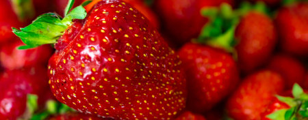 red strawberries with visible details. background or texture