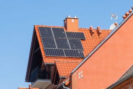 photovoltaic panels on a red tile roof