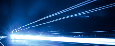 blue car lights at night. long exposureの写真素材