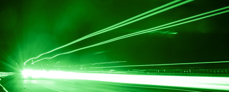 green car lights at night. long exposureの写真素材