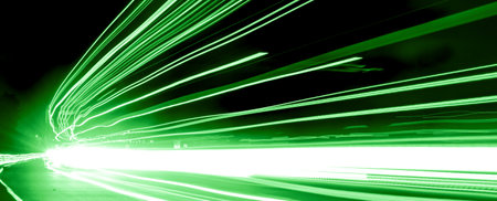 green car lights at night. long exposure