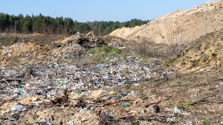 wild garbage dump. residual glass, plastics in the forest