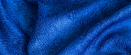 wrinkled blue cotton fabric with visible textureの写真素材