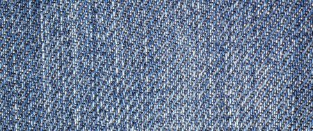 blue denim fabric with visible details. texture or backgroundの写真素材