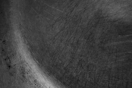 black old aluminum sheet from a frying panの写真素材