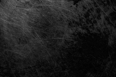 black old aluminum sheet with burnt marks from the panの写真素材