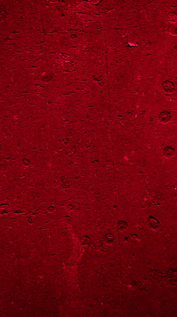 wall painted with red paint with an interesting texture