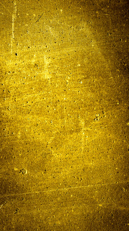 wall painted with gold paint with an interesting textureの写真素材