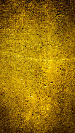 wall painted with gold paint with an interesting textureの写真素材