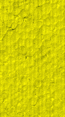 yellow polystyrene with visible details. background or bexturaの写真素材