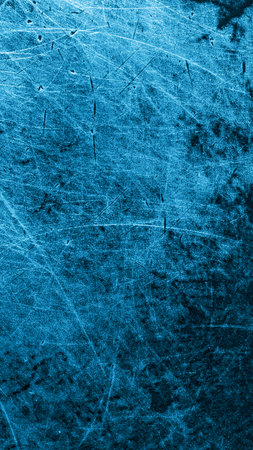 blue old aluminum sheet with burnt marks from the panの写真素材