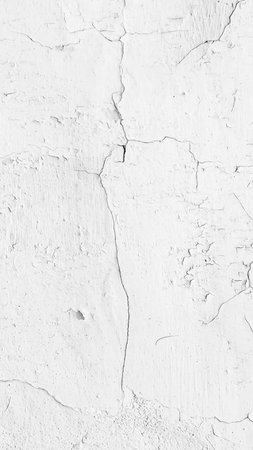 white cracked wall with visible details. background