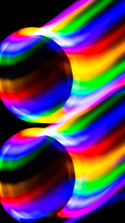 multicolored rainbow lines on black backgroundの写真素材