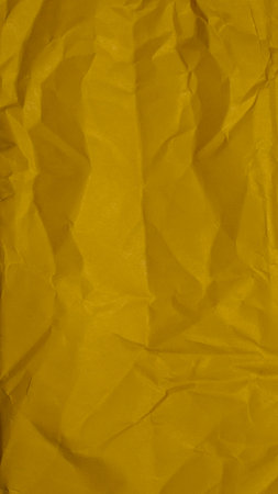 yellow sheet of paper with visible texture. background