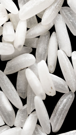 white rice on a black isolated backgroundの写真素材