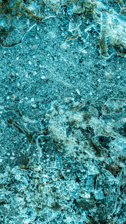 blue ice with visible details. interesting background