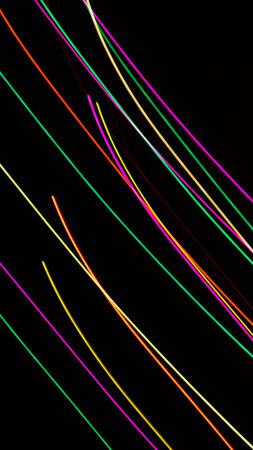 colored lines on a black background.texturaの写真素材