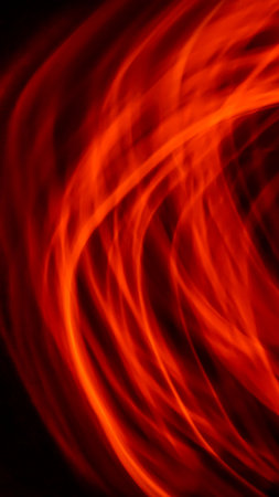 red luminous lines on a black backgroundの写真素材