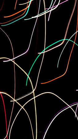 colored lines on a black background.texturaの写真素材