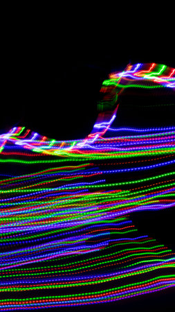 colored lines on a black background.texturaの写真素材