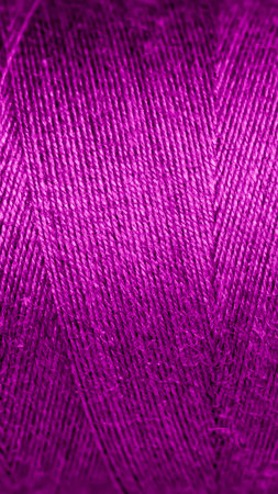 violet cotton threads with visible details. background