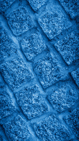 a blue stone wall with visible textureの写真素材