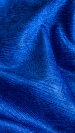 wrinkled blue cotton fabric with visible textureの写真素材