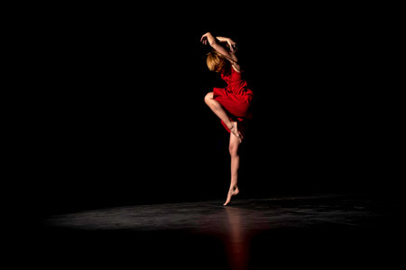 a female dancer in red dressの写真素材