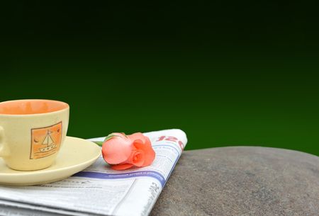 Newspaper teacup rose in green backgroundの写真素材