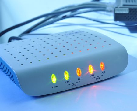 Networking and security concepts.  ADSL router on a white background.