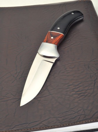 Knife in leather background