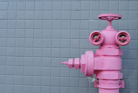 Closeup of Pink water pipe plumbing valveの写真素材