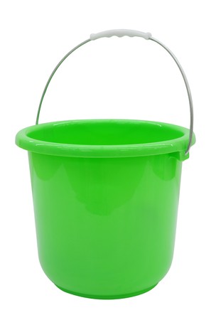 Empty Green bucket on a bright Background の写真素材