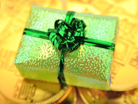Close-up of gift box and gold coinsの写真素材