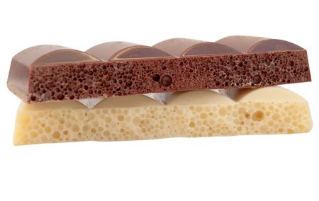 Black and white porous chocolate on a white backgroundの写真素材