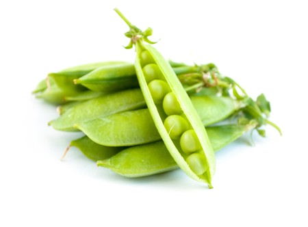 Green peas pods on a white backgroundの写真素材