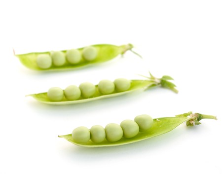 Green peas pods on a white backgroundの写真素材