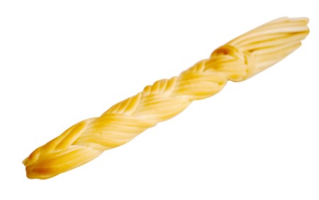 Smoked cheese a plait on a white backgroundの写真素材