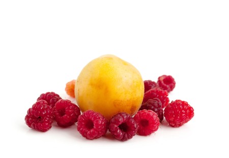 apricot and raspberry on white backgroundの写真素材