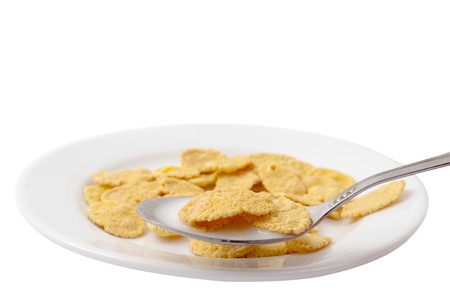 cornflakes with milk on white backgroundの写真素材