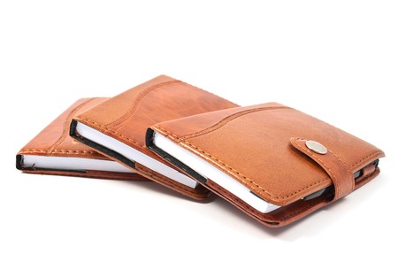 brown diaries on a white background