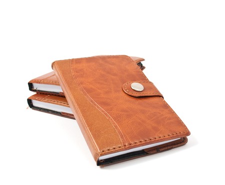 brown diaries on a white backgroundの写真素材