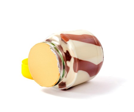 Chocolate and peanut butter in  jar isolated on whiteの写真素材