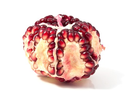pomegranate seeds on a white backgroundの写真素材