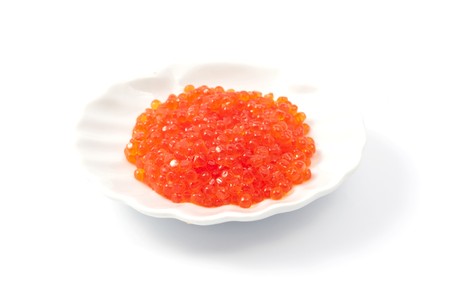 red caviar on the plate on a white backgroundの写真素材