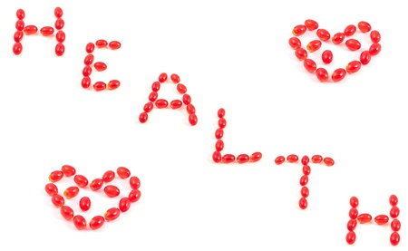 background of hearts and the words of the health of the vitaminsの写真素材