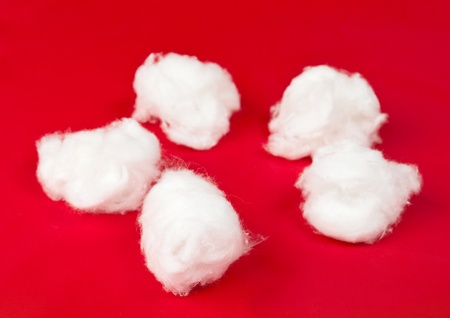 Medical cotton on a red backgroundの写真素材